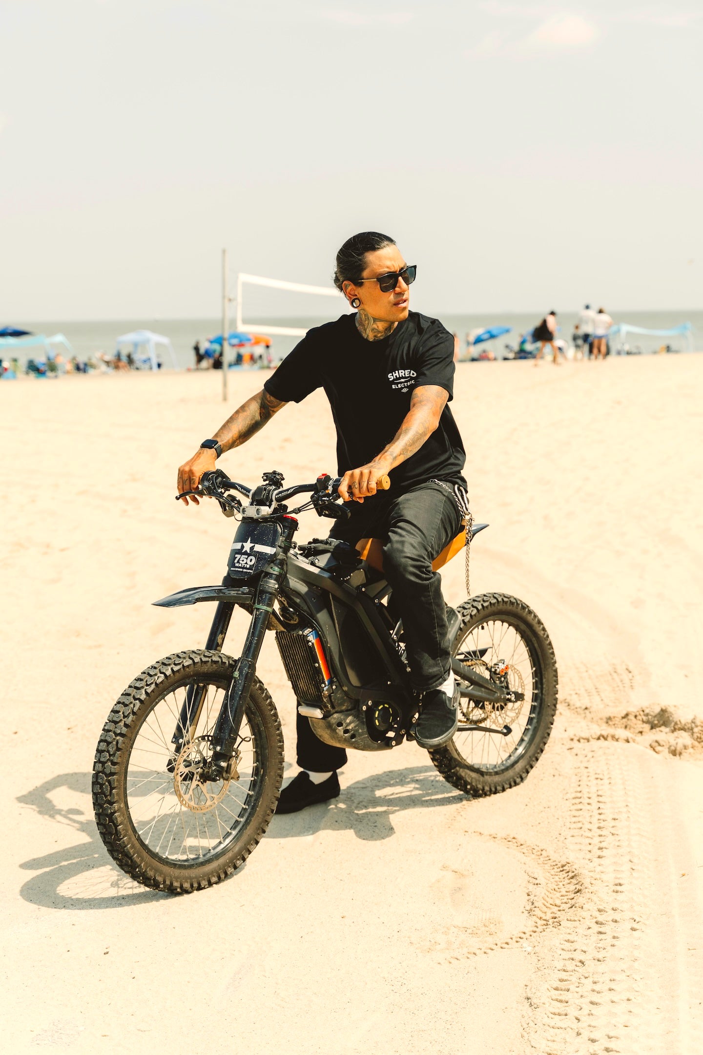 Person riding a bike on a  beach