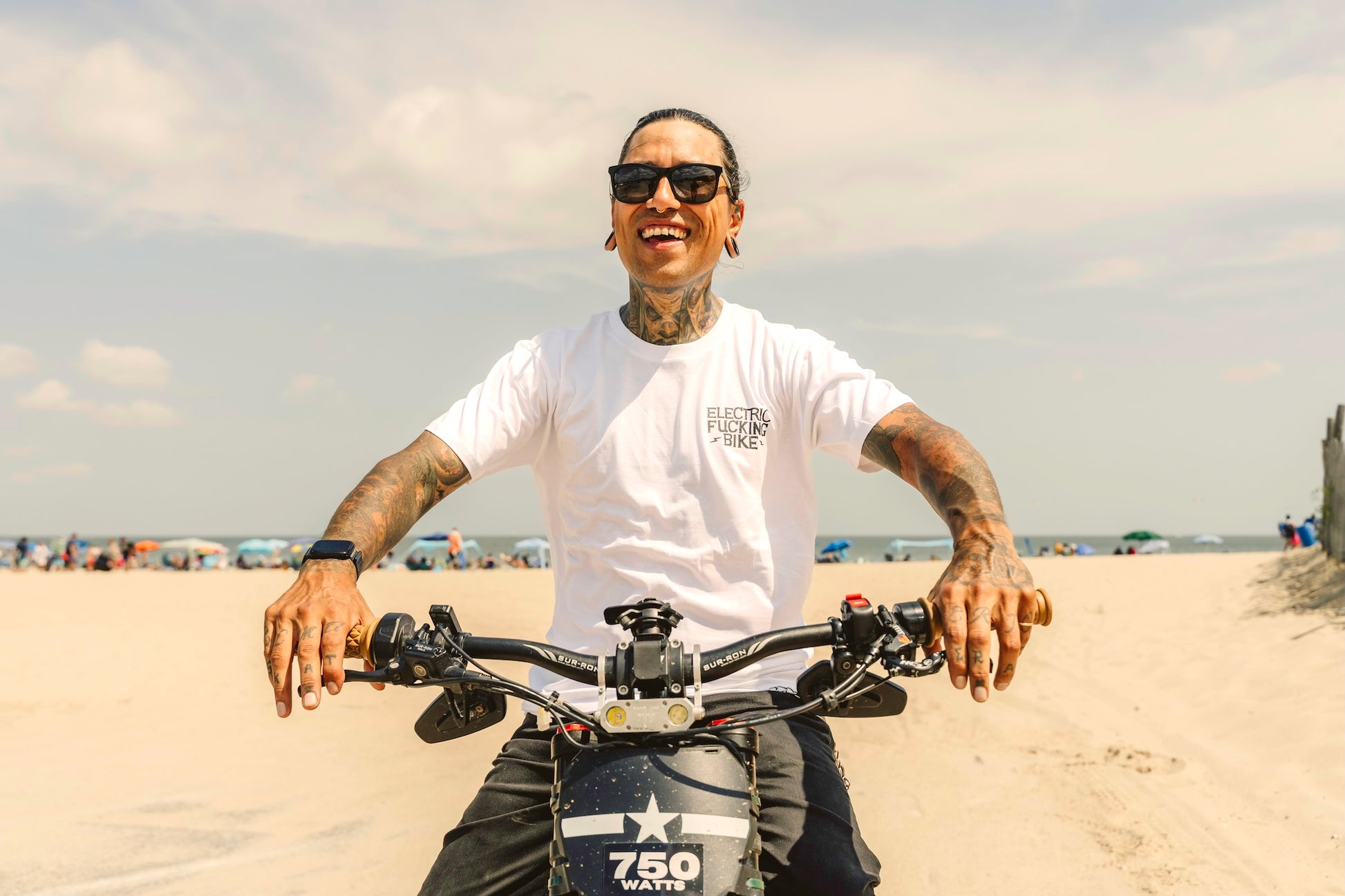 Man smiling wearing Electric bike shirt on dirt bike