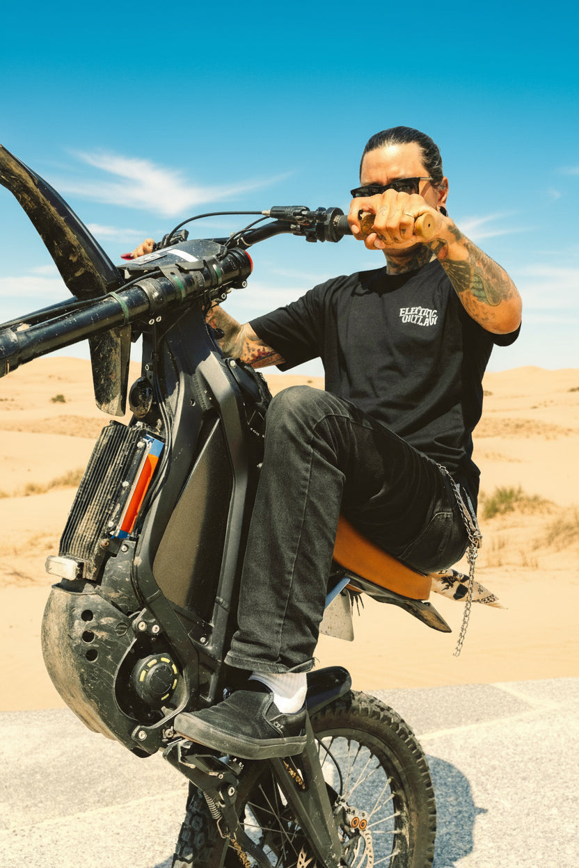 Person showing electric bike upgrades doing a wheelie