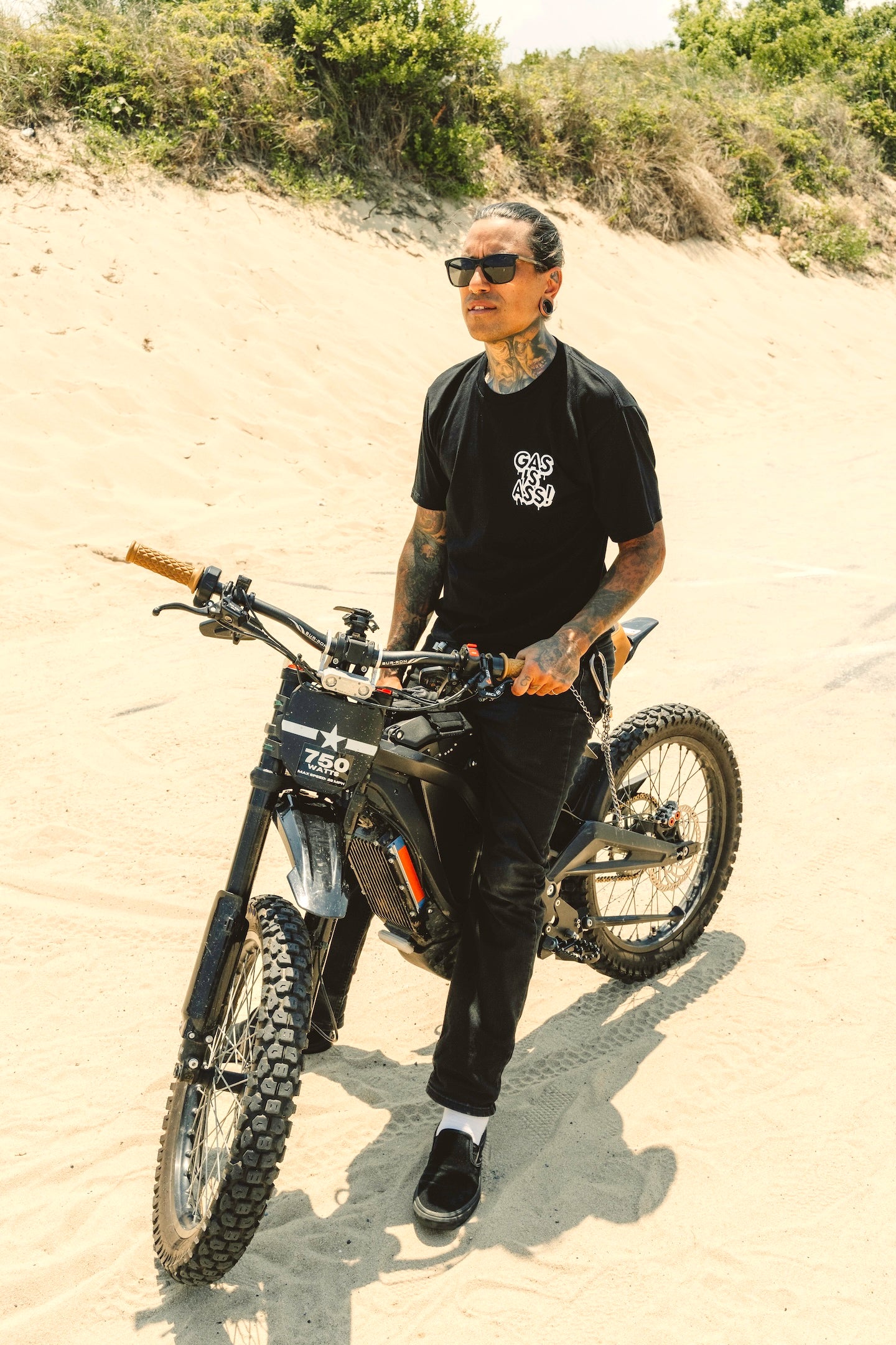 Gas Is Ass! Black T-shirt front view on electric bike