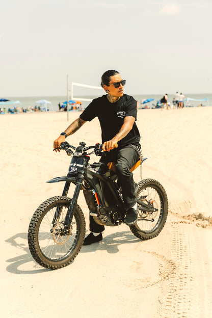 Person Shreddie Mcskate riding electric dirt bike