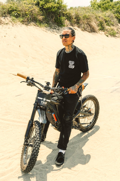 Gas Is Ass! Black T-shirt front view on electric bike